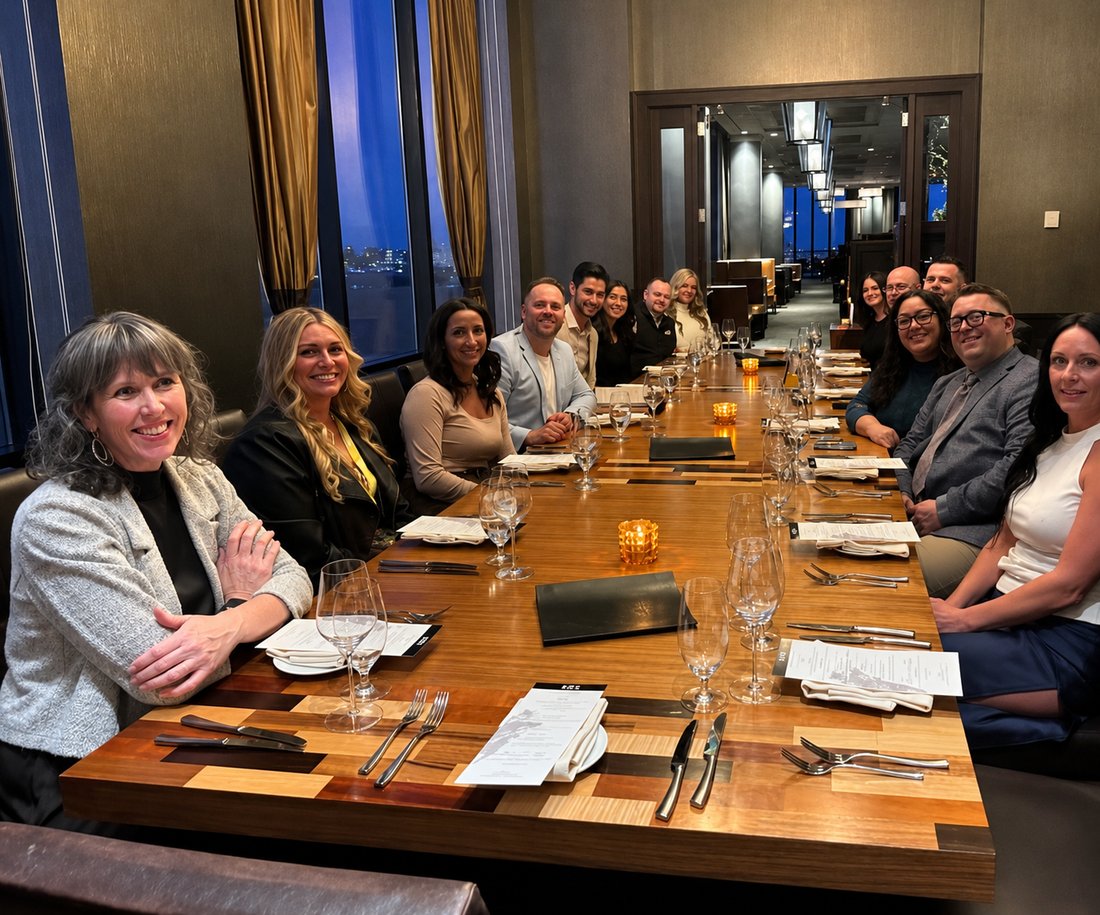 The Pampena Financial Group team celebrating together at a company dinner